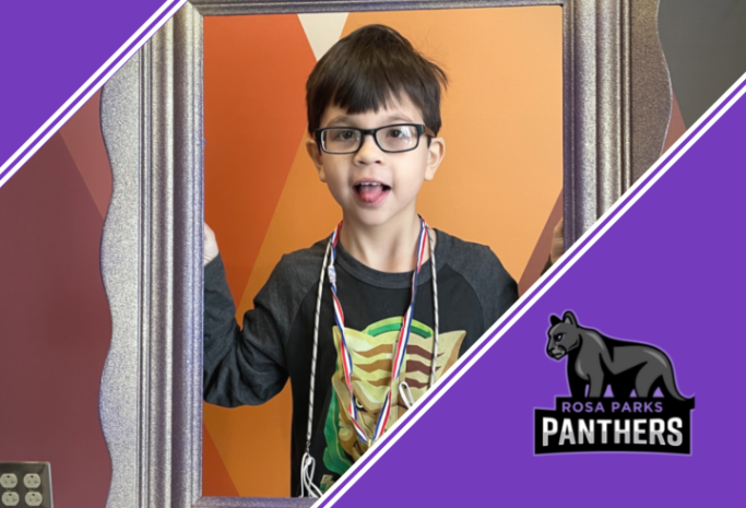 Student standing in a picture frame with Panthers logo
